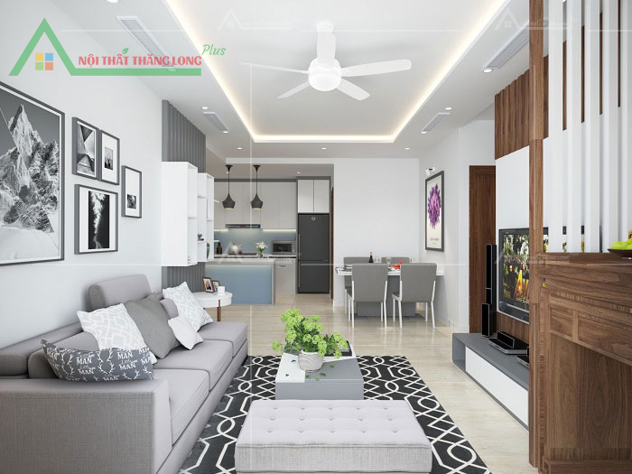 Sự kết hợp giữa gam màu sáng và nội thất gỗ tạo nên điểm nhấn cho phòng khách